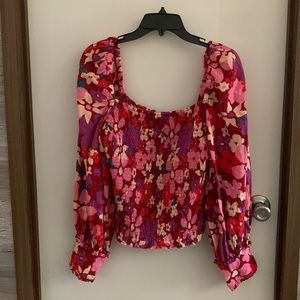 Free People Ariana Bold printed top. Size L Long Sleeve Cuffed .